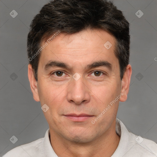 Joyful white adult male with short  brown hair and brown eyes