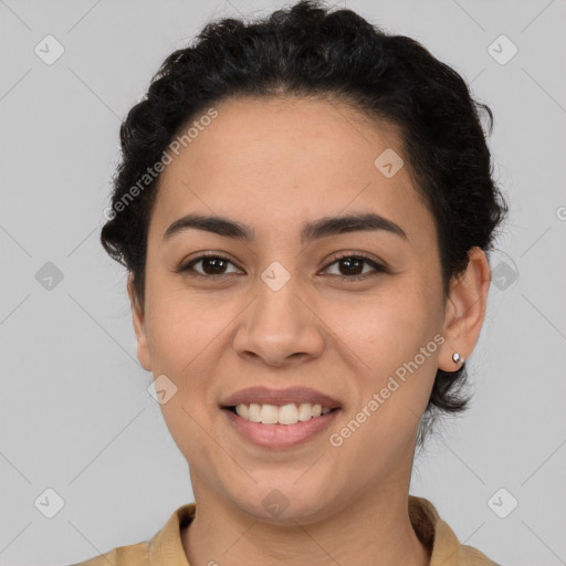 Joyful latino young-adult female with short  brown hair and brown eyes