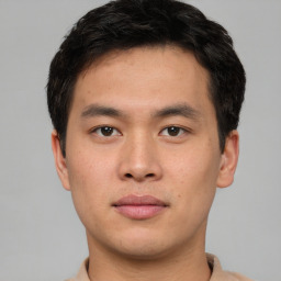 Neutral asian young-adult male with short  brown hair and brown eyes