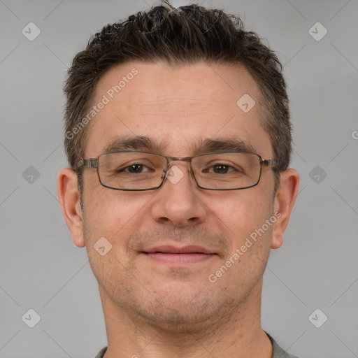 Joyful white adult male with short  brown hair and brown eyes