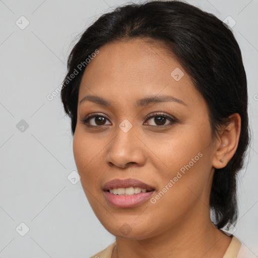 Joyful asian young-adult female with medium  brown hair and brown eyes