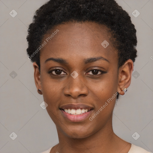 Joyful black young-adult female with short  black hair and brown eyes