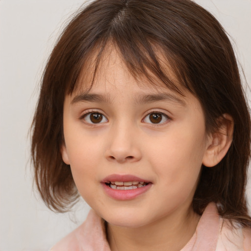 Joyful white child female with medium  brown hair and brown eyes