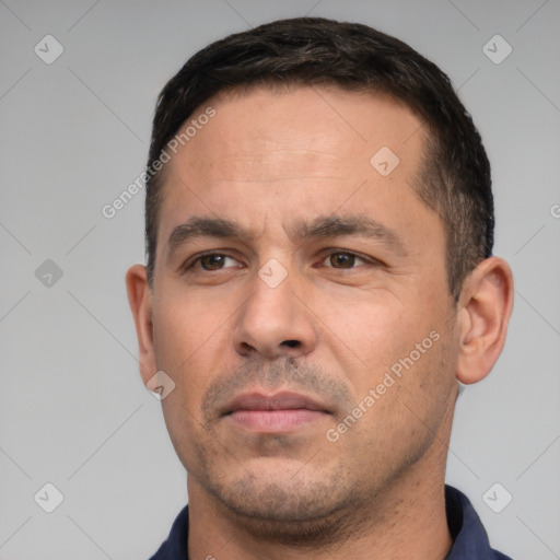 Neutral white adult male with short  black hair and brown eyes