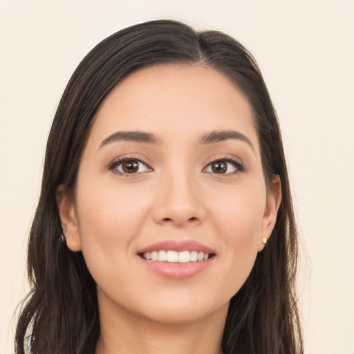 Joyful white young-adult female with long  brown hair and brown eyes