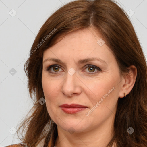 Joyful white adult female with long  brown hair and brown eyes