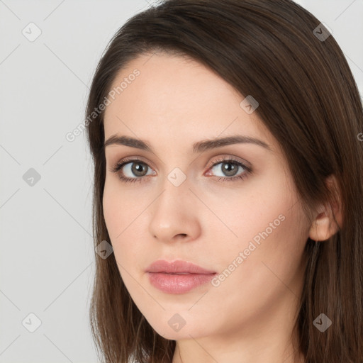 Neutral white young-adult female with long  brown hair and brown eyes