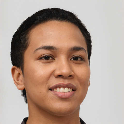 Joyful latino young-adult female with short  black hair and brown eyes