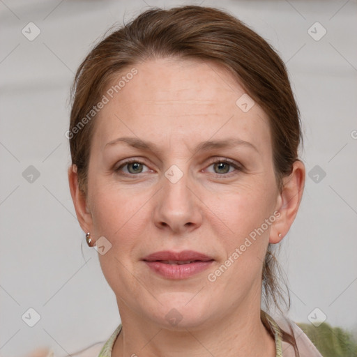 Joyful white adult female with short  brown hair and grey eyes