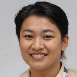 Joyful asian young-adult female with short  brown hair and brown eyes