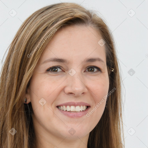 Joyful white young-adult female with long  brown hair and brown eyes