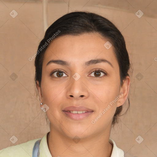 Joyful latino young-adult female with short  brown hair and brown eyes