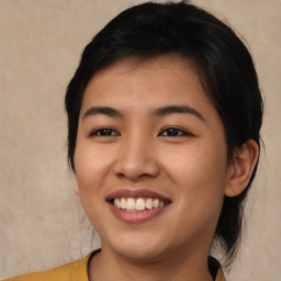 Joyful asian young-adult female with medium  brown hair and brown eyes