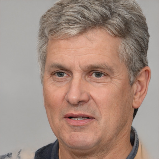 Joyful white middle-aged male with short  brown hair and brown eyes