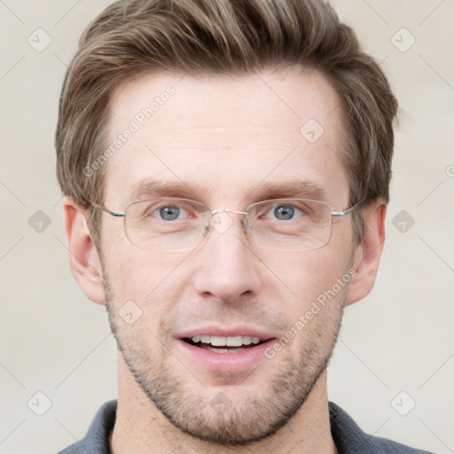 Joyful white adult male with short  brown hair and grey eyes