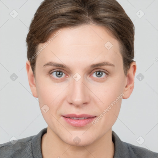 Joyful white young-adult female with short  brown hair and grey eyes