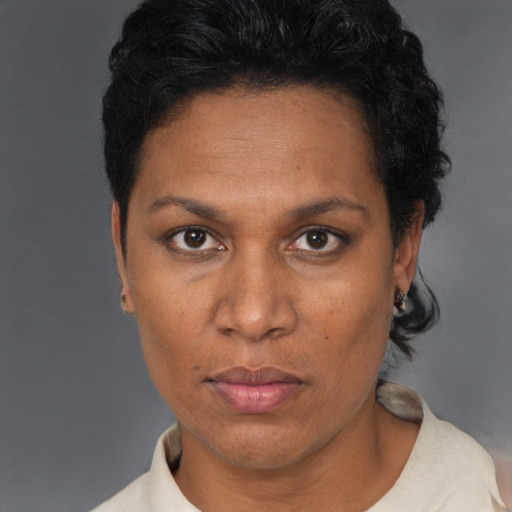 Neutral black adult female with short  brown hair and brown eyes