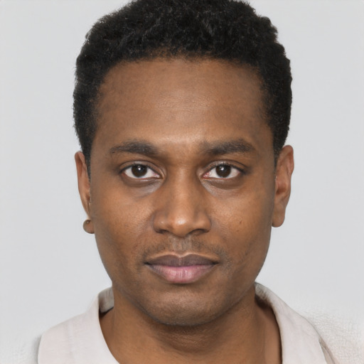 Neutral black young-adult male with short  black hair and brown eyes
