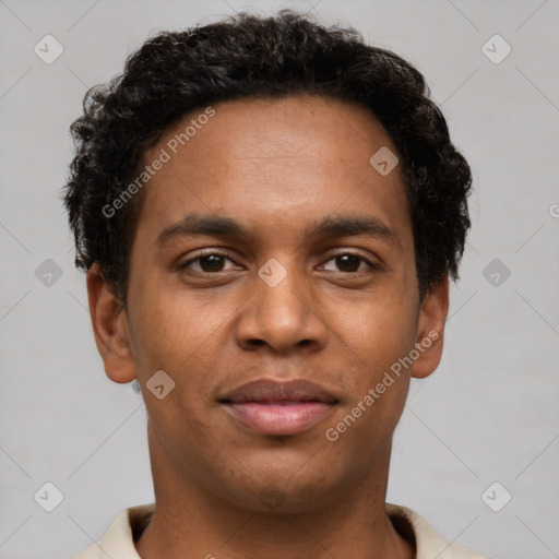 Joyful black young-adult male with short  brown hair and brown eyes