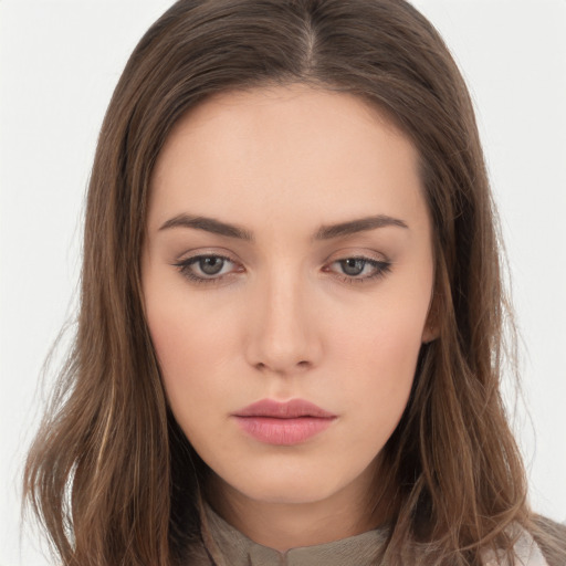 Neutral white young-adult female with long  brown hair and brown eyes