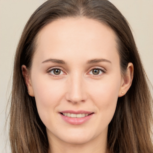 Joyful white young-adult female with long  brown hair and brown eyes