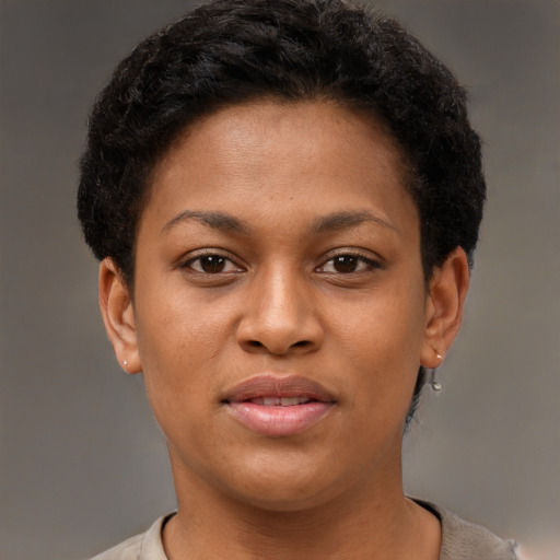 Joyful black young-adult female with short  brown hair and brown eyes
