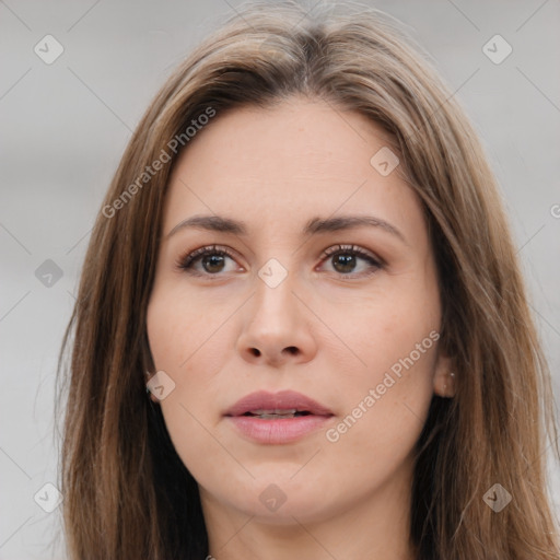 Neutral white young-adult female with long  brown hair and brown eyes