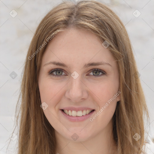 Joyful white young-adult female with long  brown hair and green eyes