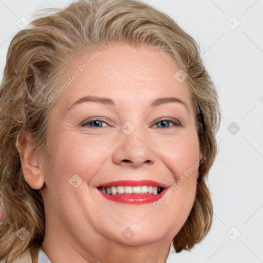 Joyful white adult female with medium  brown hair and blue eyes