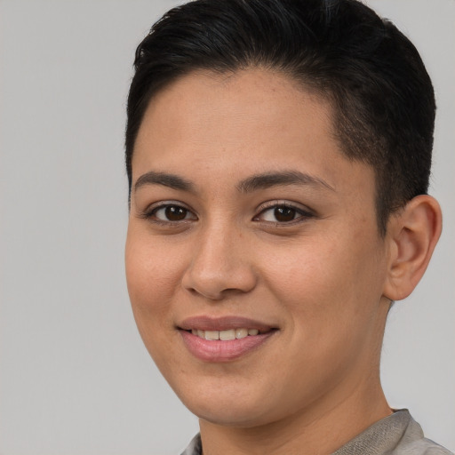 Joyful white young-adult female with short  brown hair and brown eyes