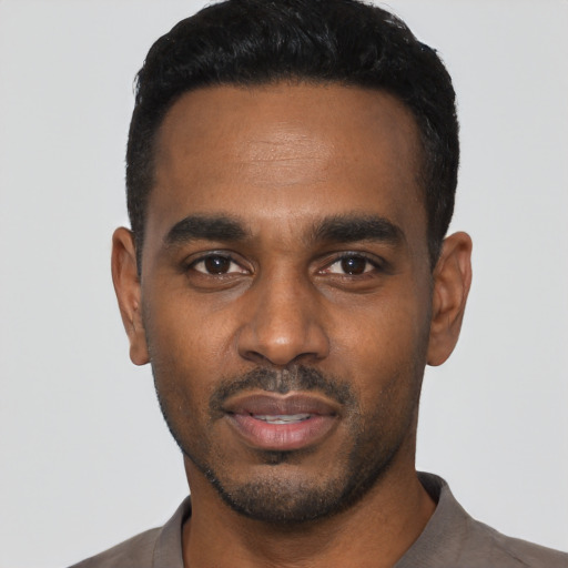 Neutral black young-adult male with short  black hair and brown eyes
