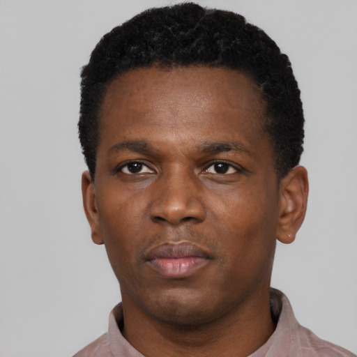 Neutral black young-adult male with short  black hair and brown eyes