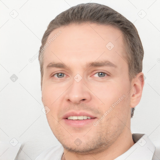 Joyful white adult male with short  brown hair and brown eyes