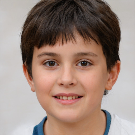 Joyful white child male with short  brown hair and brown eyes