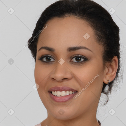 Joyful latino young-adult female with medium  brown hair and brown eyes