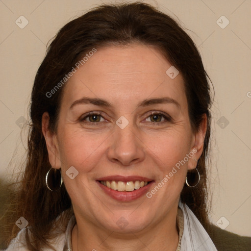 Joyful white adult female with medium  brown hair and brown eyes