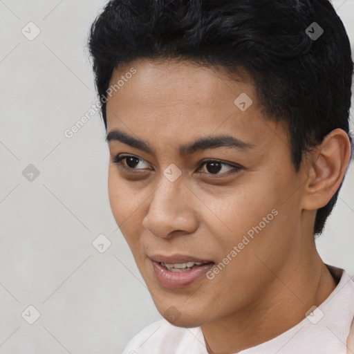 Joyful latino young-adult female with short  black hair and brown eyes