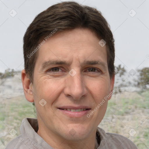 Joyful white adult male with short  brown hair and grey eyes