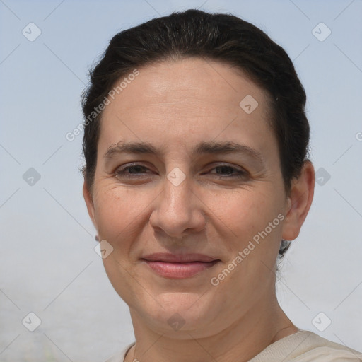 Joyful white adult female with short  brown hair and brown eyes