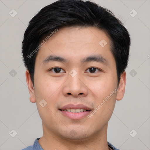 Joyful asian young-adult male with short  black hair and brown eyes