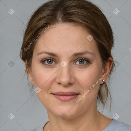 Joyful white adult female with medium  brown hair and grey eyes