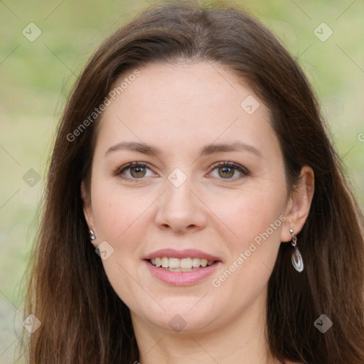 Joyful white young-adult female with long  brown hair and green eyes