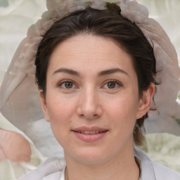 Joyful white young-adult female with medium  brown hair and brown eyes