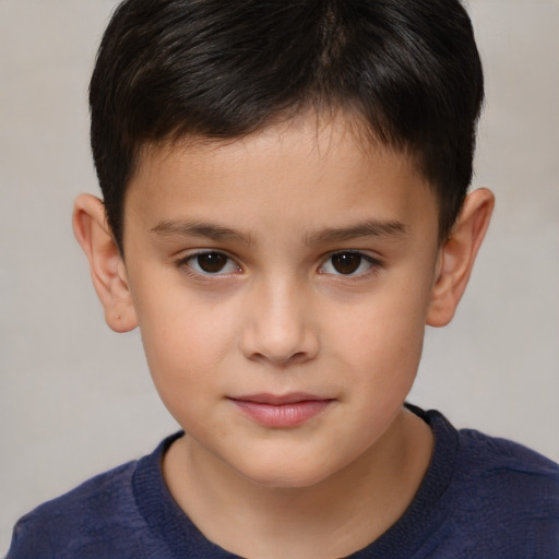 Joyful white child male with short  brown hair and brown eyes