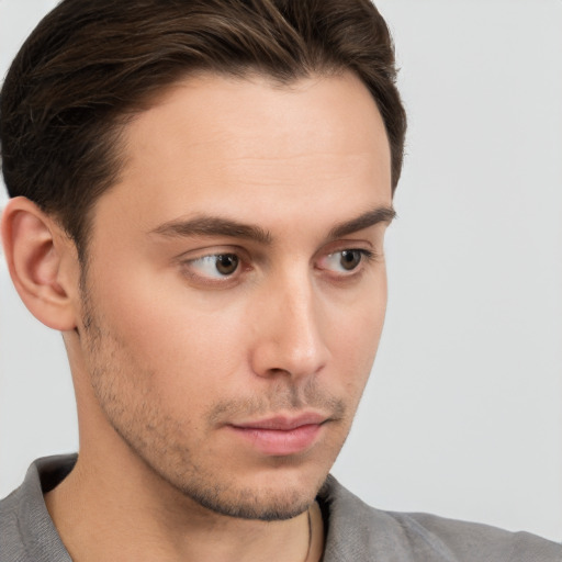 Neutral white young-adult male with short  brown hair and brown eyes