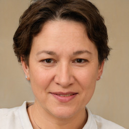 Joyful white adult female with short  brown hair and brown eyes