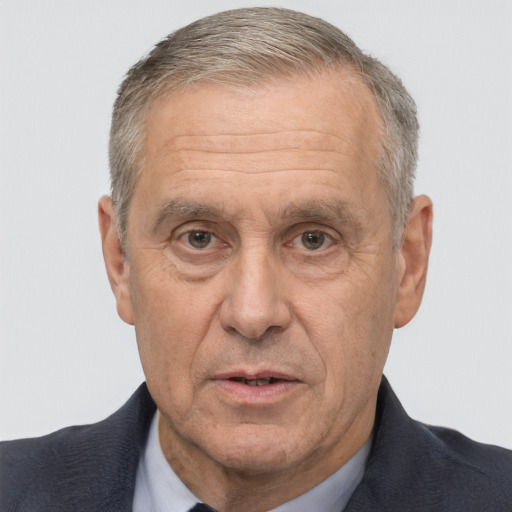 Neutral white middle-aged male with short  gray hair and brown eyes