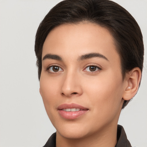 Joyful white young-adult female with short  brown hair and brown eyes