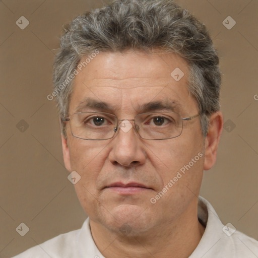 Neutral white middle-aged male with short  gray hair and brown eyes