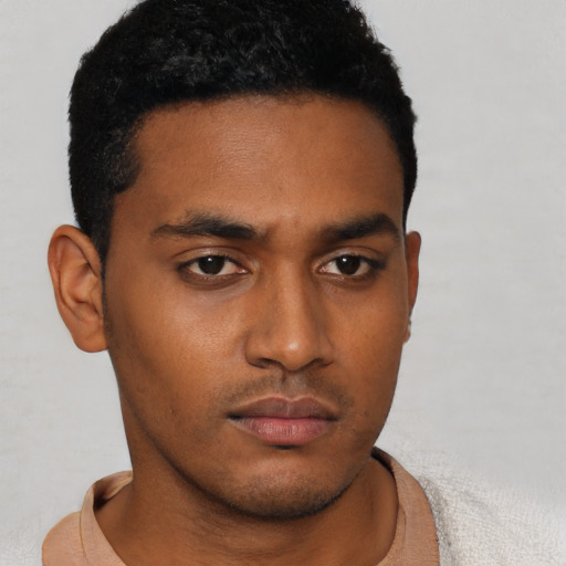 Neutral latino young-adult male with short  brown hair and brown eyes